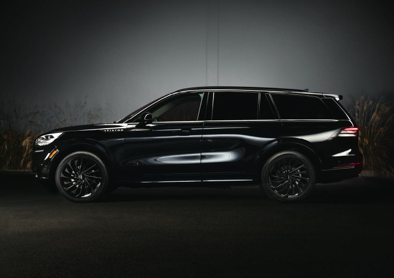 A 2024 Lincoln Aviator® SUV is shown in the Infinite Black exterior color | Buss Lincoln in McHenry IL