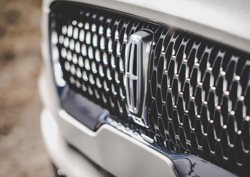 The grille of the 2024 Lincoln Aviator® Reserve model with an eye-catching repeated field of Lincoln Star logo shapes | Buss Lincoln in McHenry IL