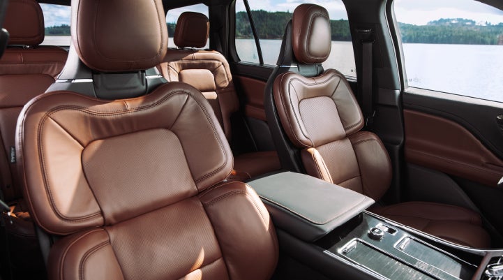 The front row's Perfect Position Seats in a 2024 Lincoln Aviator® Reserve model with Ebony Roast interior | Buss Lincoln in McHenry IL