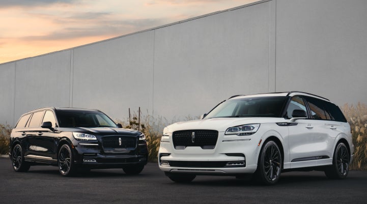 Two Lincoln Aviator® SUVs are shown with the available Jet Appearance Package | Buss Lincoln in McHenry IL