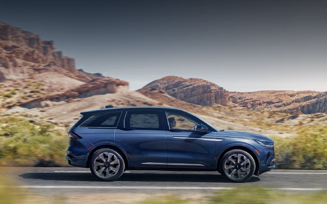 A 2024 Lincoln Nautilus® SUV is being driven in a desert setting. | Buss Lincoln in McHenry IL